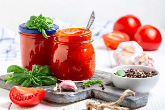Jars with tomato sauce.