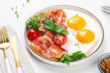 Fried Eggs and Bacon with Cherry Tomatoes on Plate, Breakfast, Keto, Paleo Diet Lunch