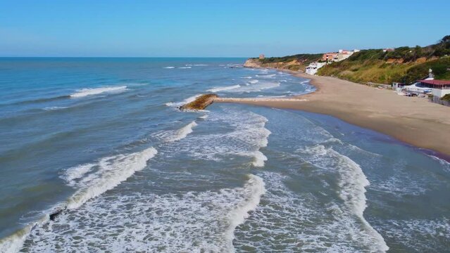 Tor di Caldano old tower in Anzio, near Rome, Italy. Beach and sea