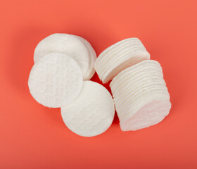 Cotton Disks, Hygiene Pads on Pink Background, Round Facial Sponge, Soft Clear Disk Stack