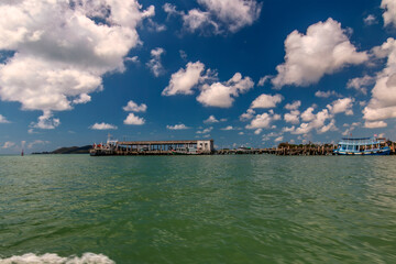 Tranquil Oasis: Rayong, Thailand's pier in the Gulf of Thailand, surrounded by fishing and tourist...