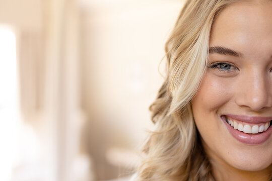 Closeup Portrait Of Blonde Plus Size Caucasian Young Woman Smiling And Looking At Camera, Copy Space