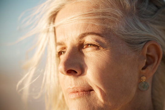 Face, Thinking And A Mature Woman Outdoor In Wind For Freedom, Memory Or Travel In Summer. Headshot And Beauty Of Serious Female Person In Nature For Air, Retirement Vision And Holiday Or Vacation