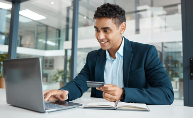 Credit card, businessman and laptop with online banking, payment and ecommerce store. Computer, male professional and smile of a corporate worker with web shopping on an internet retail shop at work