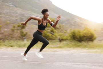 Athlete, fitness and fast black woman running and training for outdoor sports, workout and exercise for a marathon. Strong, wellness and healthy female person or runner with speed for health