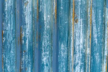 Fototapeta na wymiar Old peeled blue metal profile as a texture, pattern, background