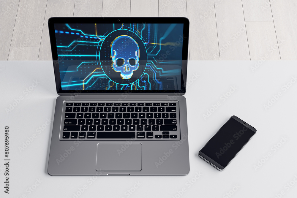 Poster close up of laptop with blue circuit skull hologram on screen and cellphone on white desktop. cyber 