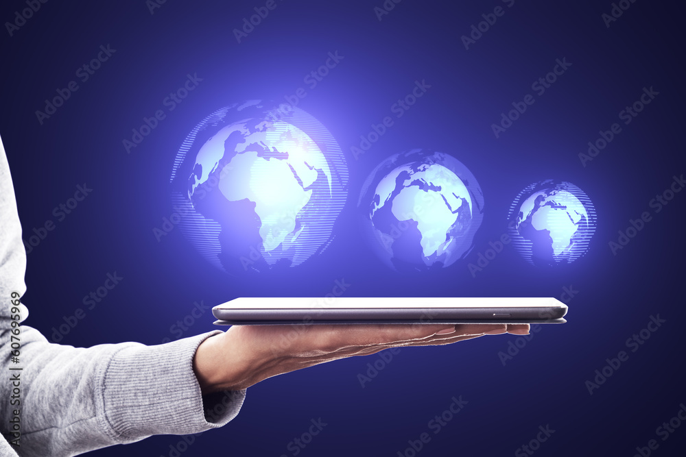 Poster Close up of female hand using cellphone with glowing digital globe hologram on dark background. Digital world, global hacking protection and hud concept.