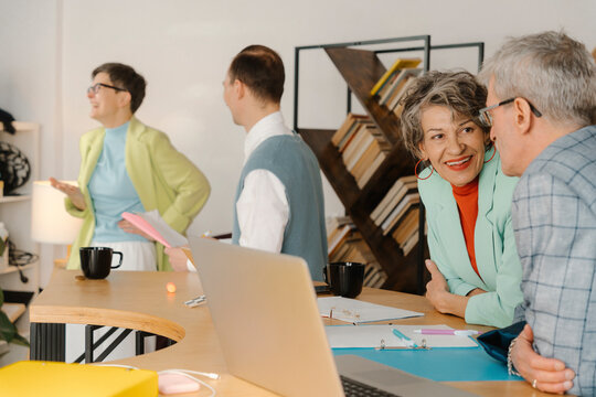 Business people talking in studio, taking a break during recording online class