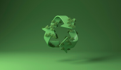 Recycle sign covered with green plants against green background