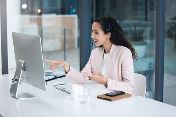 Call center, video call and woman in customer support on computer with headset for consulting. Telemarketing, communication and female worker point to pc screen for crm service, help desk and contact