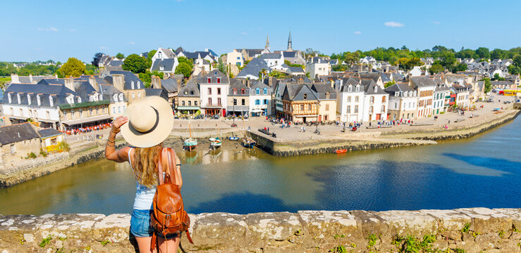 Woman tourist traveling in Brittany- Saint Goustan port, Auray city landscape- France, Morbihan