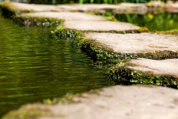stone slabs over a pond