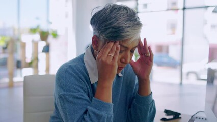 Business, headache and senior woman with stress and anxiety from computer work. Burnout, employee and female worker with pain and fatigue from bankruptcy and financial crash with tax challenge