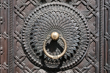 Door handle of Matenadaran Museum on sunny day. Yerevan, Armenia.