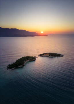 Aerial view of Ksamil Islands at sunset along the coastline in Saranda, Vlore, Albania.