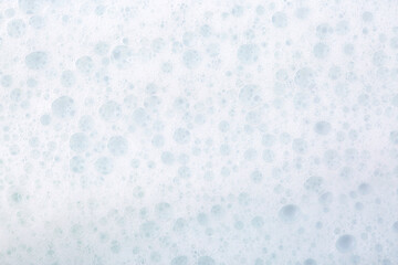 Soap foam close-up as a background. Facial cleanser foam bubbles. A foam party.