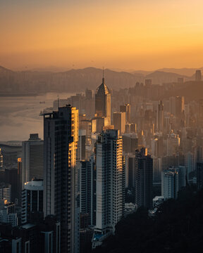 Aerial view of Hong Kong skyline and the financial district at sunrise along Hong Kong Island coastline, China.