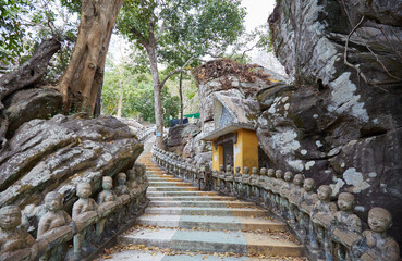 Fototapeta premium Phnom Santuk, a sacred Buddhist pilgrimage spot in Cambodia, known for its rock carvings and sculptures