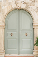 Old vintage wooden door. Traditional European architecture. Summer travel concept