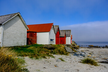 Fototapeta na wymiar Row Or Line Of Traditional Colourful Beach Huts
