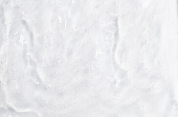 Obraz premium Cosmetic gel, serum transparent sample. Liquid cream with bubble texture. Gel texture of a cosmetic product. Clear liquid lotion for skin care.
