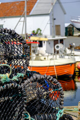 Pile of Lobster Or Crab Fishing Pots With Fishing Boat