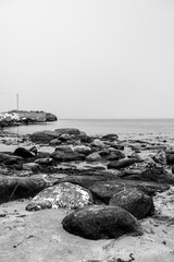 Black And White Beach Scene With Rocky Outcrops And No People