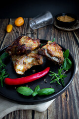 Roasted ribs with rosemary and sauces. On a wooden background