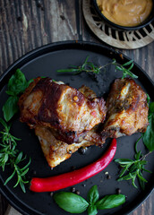 Roasted ribs with rosemary and sauces. On a wooden background