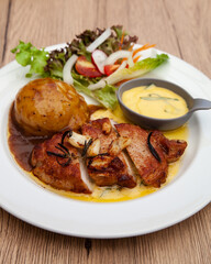 Pork sirloin steak with mash potato and bearnaise sauce