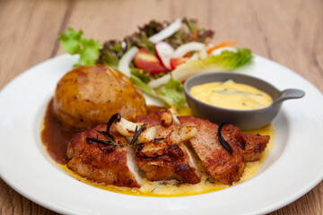 Pork sirloin steak with mash potato and bearnaise sauce