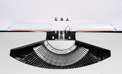 Text m and a typed on retro typewriter