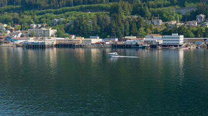 Fototapeta na wymiar landscape with biplane at seaside alaska city. landscape with biplane in water.