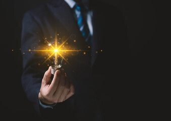 businessman holding a light bulb Digital technology. idea creative	
