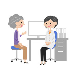 診察室で女医に説明するシニア女性.