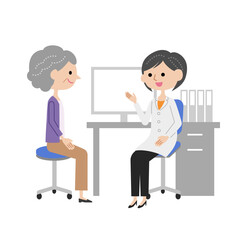 診察室で女医に説明を受けるシニア女性