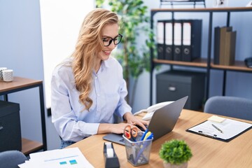 Fototapeta na wymiar Young blonde woman business worker using laptop working at office