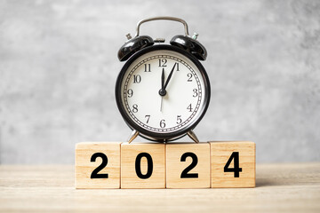 2024 text with clock on table. Resolution, time, plan, goal, motivation, reboot, countdown and New Year holiday concepts