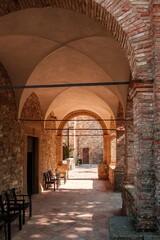 The old Romanesque church with its cloister in Carpegna village in the Marche region in central Italy