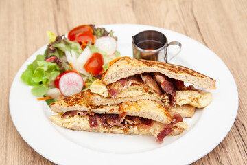 French toast with omelette and bacon for breakfast, brunch