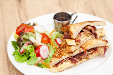 French toast with omelette and bacon for breakfast, brunch