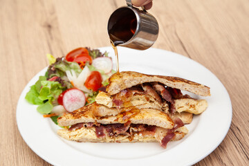 French toast with omelette and bacon for breakfast, brunch