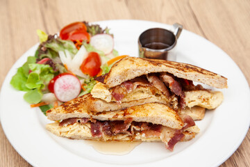 French toast with omelette and bacon for breakfast, brunch