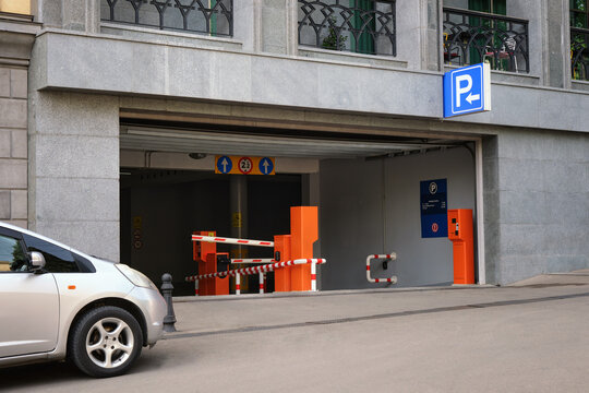 Close-up of an automatic barrier at the entrance to an underground parking.