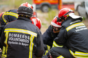 Car Crash Traffic Accident. Firefighters Rescue Injured Trapped Victims. Firemen give First Aid to passengers. High quality photography.