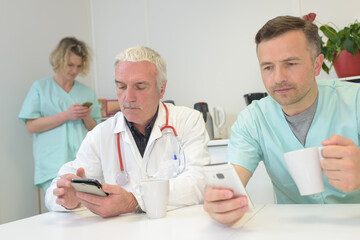 medical staffs with their smartphones during break time