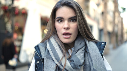 Fototapeta premium Young beautiful hispanic woman standing with surprise expression at street