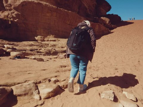 A girl walking in the Wadi Rum