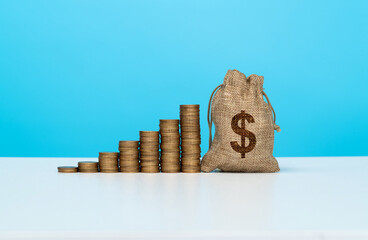 Coin stacks with money bag